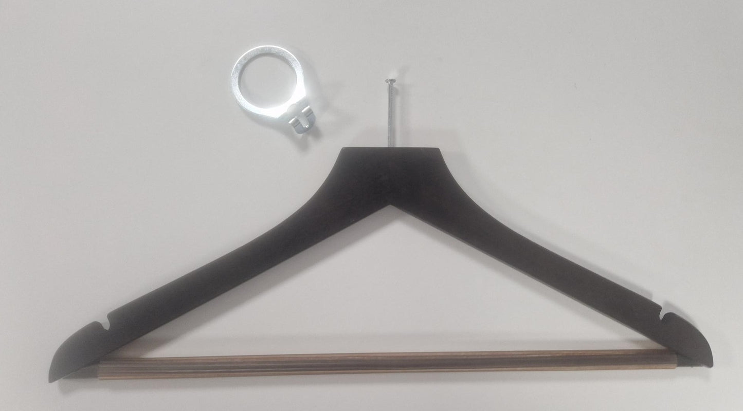 A Rustic Motifs Wooden Hotel Anti Theft Jacket (Dark Brown) 44cm is lying against a white background. Above the hanger is a metal ring-like object with a small bracket attached, emphasizing security priority for guests.