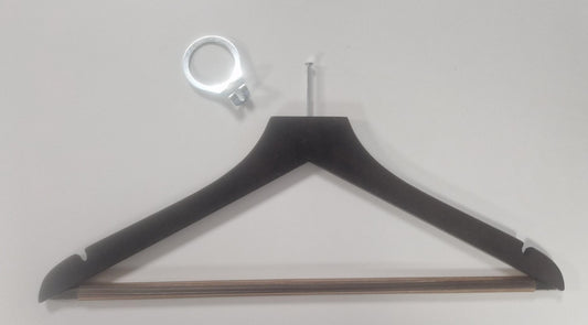 A Rustic Motifs Wooden Hotel Anti Theft Jacket (Dark Brown) 44cm is lying against a white background. Above the hanger is a metal ring-like object with a small bracket attached, emphasizing security priority for guests.