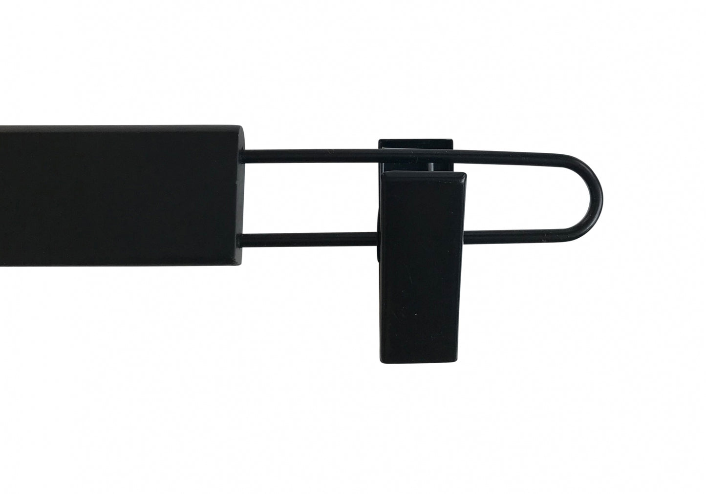 A Black Wooden Clip Bottom Hanger 37cm by Rustic Motifs on a white background. The hanger extends outward from the main body, a rectangular block, and curves back inward at the end. A small sturdy clip is attached near the curved end. The design allows for versatile use with 360-degree rotation capabilities.