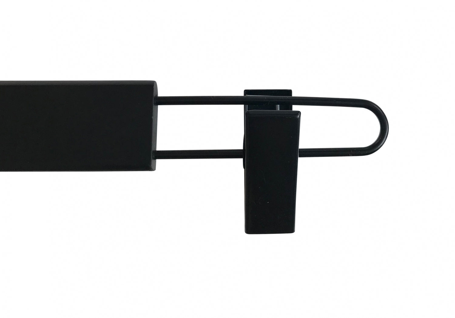 A Black Wooden Clip Bottom Hanger 37cm by Rustic Motifs on a white background. The hanger extends outward from the main body, a rectangular block, and curves back inward at the end. A small sturdy clip is attached near the curved end. The design allows for versatile use with 360-degree rotation capabilities.