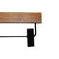 An image of a black metal clip attached to an FSC certified wooden hanger bar. The clip, designed to hold items such as pants or skirts, is aligned perpendicular to the sustainable dark wood hanger from Rustic Motifs. This specific product is the Dark Wood Sustainable Bottom Trouser Skirt Hanger With Clips 37cm. The background is plain white.
