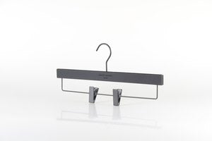 A Wooden Rubber Soft Touch Kids Bottom Harvey Nichols 32cm from Rustic Motifs is pictured against a white background. The hanger features two adjustable clips for securing garments, making it an excellent choice for wardrobe organization.