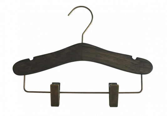 The Rustic Motifs Wooden Antique Kids Top Clip (Gun Metal Hook) with a brass hook showcases timeless elegance with its notches for securing garments. It also features a brass bottom bar equipped with two adjustable clips for holding pants or skirts. The wooden antique finish is set against a plain white background.