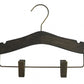 The Rustic Motifs Wooden Antique Kids Top Clip (Gun Metal Hook) with a brass hook showcases timeless elegance with its notches for securing garments. It also features a brass bottom bar equipped with two adjustable clips for holding pants or skirts. The wooden antique finish is set against a plain white background.