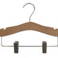 The Rustic Motifs Natural Wood Coat Kids Hanger with Bar 28cm is a high-quality wooden clothes hanger with a metal hook on top and metal clips at the bottom. Perfect for a child's wardrobe, it features a smooth, curved design with notches for securing garment straps. The adjustable metal clips are ideal for hanging pants or skirts.