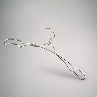 A minimalist, silver-colored wire hanger with a smooth and slightly curved design is placed against a plain gray background. This Rustic Motifs Natural Aluminium Top Notch Coat Hanger 40cm has a simple hook at the top and is slightly elevated, casting a faint shadow below, making it perfect for wardrobe organization.