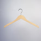 A Rustic Motifs Natural Wood Top Clothes Hanger with Notch 44cm is centered against a plain, light gray background. The hanger has notches on both sides to hold garments with straps, perfect for closet organization.