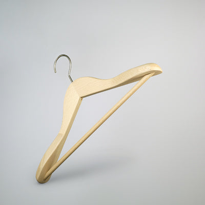 A Rustic Motifs Natural Wooden Jacket Hanger with Trouser Bar 39cm is suspended in mid-air against a light gray background. The design is minimalist and functional, perfect for efficient closet organization.