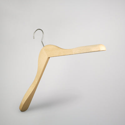 A durable wooden hanger with a metal hook is suspended against a plain white background. The Rustic Motifs Natural Wooden Jacket Top Coat Hanger 44cm has curved shoulders and a sturdy design, ideal for garment care and hanging various types of clothing.
