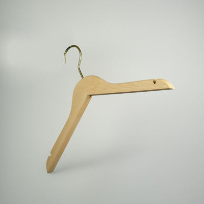 A Natural Wooden Thick Top Jacket and Bridal Hanger 39cm by Rustic Motifs is seen against a plain light gray background. The bridal notch hanger boasts a metal hook at the top for hanging and a smooth, straight bar for holding clothing. The design is simple and functional, embodying sustainability.