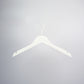 A sleek Rustic Motifs White Wooden Clothes Hanger with Notch 38cm, featuring notches for garment straps and a metal hook on top, is centered against a plain light grey background. Perfect for closet organization.