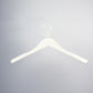 A Rustic Motifs White Wooden Jacket Top Coat Hanger 44cm is centered against a plain grey background. The hanger has a smooth, curved design with broad ends for better garment support and a small, curved hook at the top, providing an elegant upgrade from plastic alternatives.
