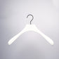 A Rustic Motifs White Wooden Jacket Top Coat Hanger 38cm with a black metal hook is centered against a light gray background. The hanger, similar to a top coat hanger, has a smooth, slightly curved shape designed to hold shirts, jackets, or other garments without causing wrinkles.
